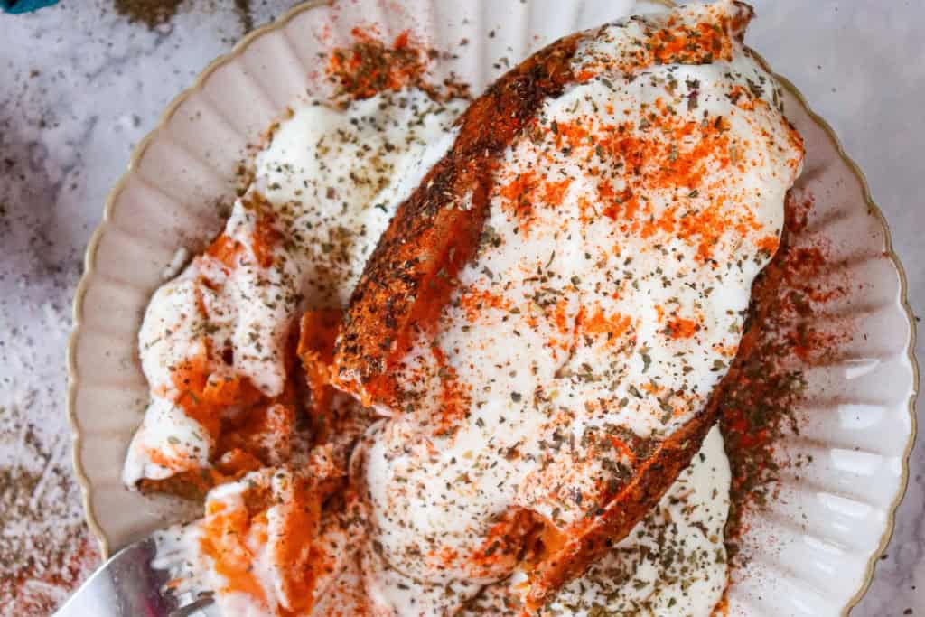 Air Fryer Sweet Potato Jackets topped with Greek yogurt and seasonings
