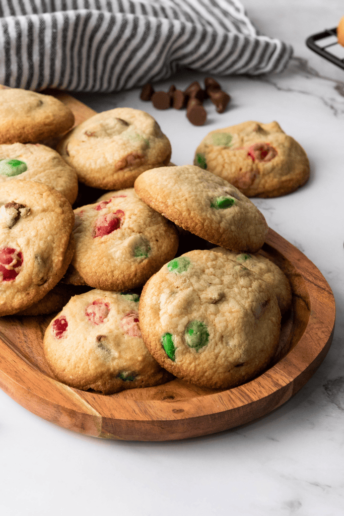 Christmas M & M Cookies on a wooden tray