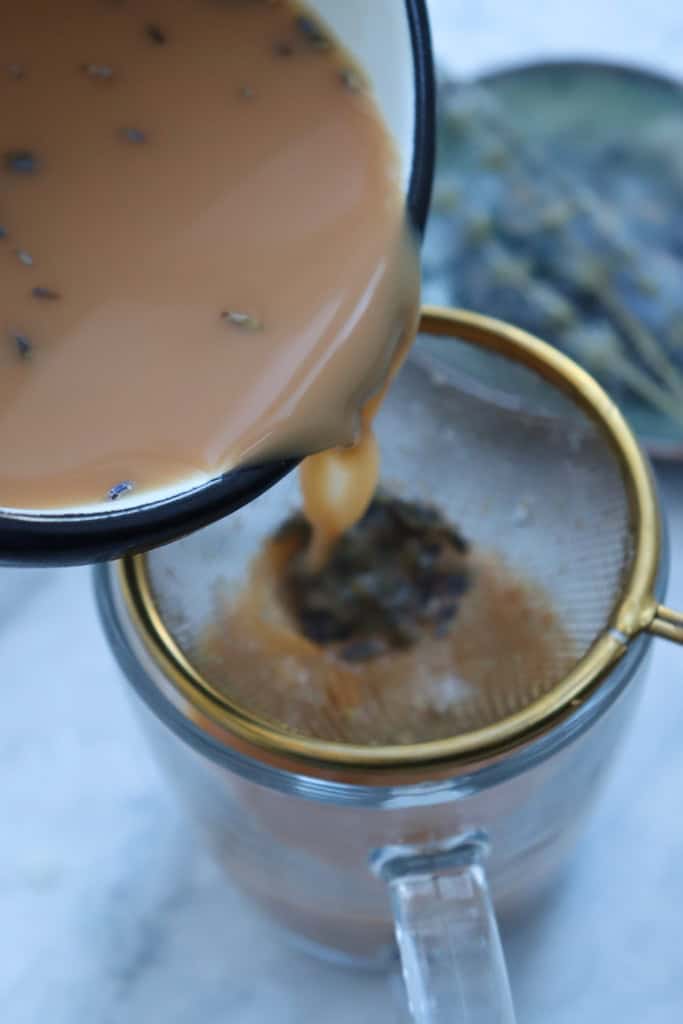 Pouring the tea into a strainer