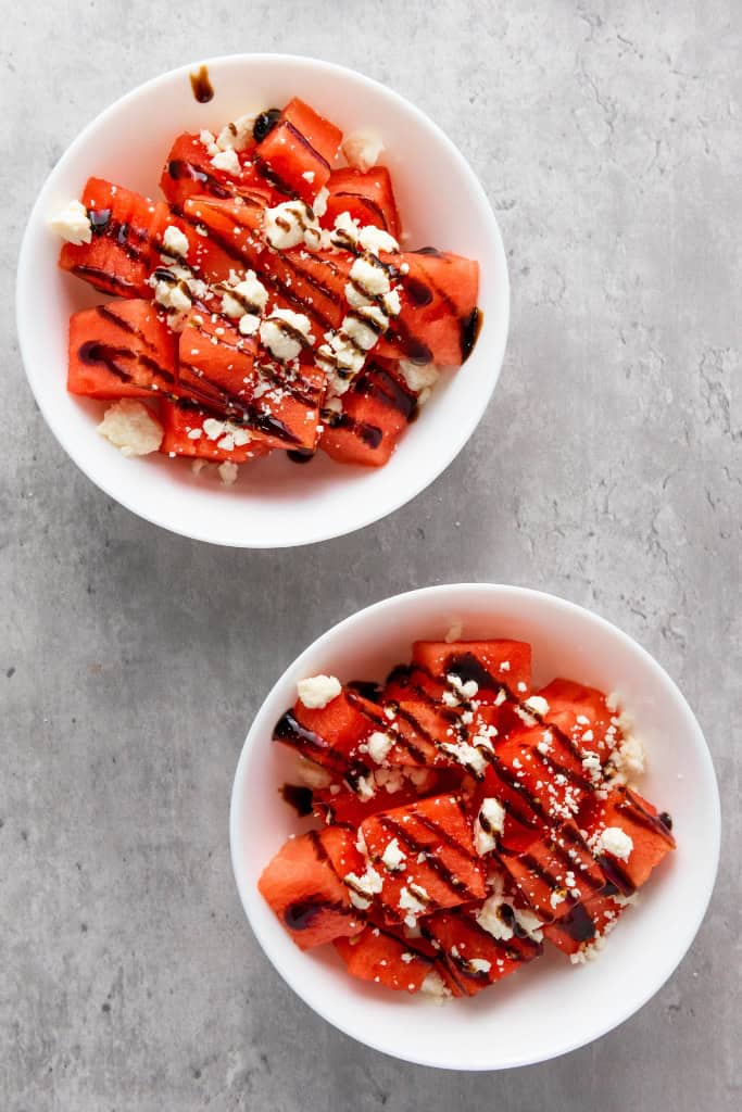 Cubed watermelon with feta drizzled with balsamic glaze