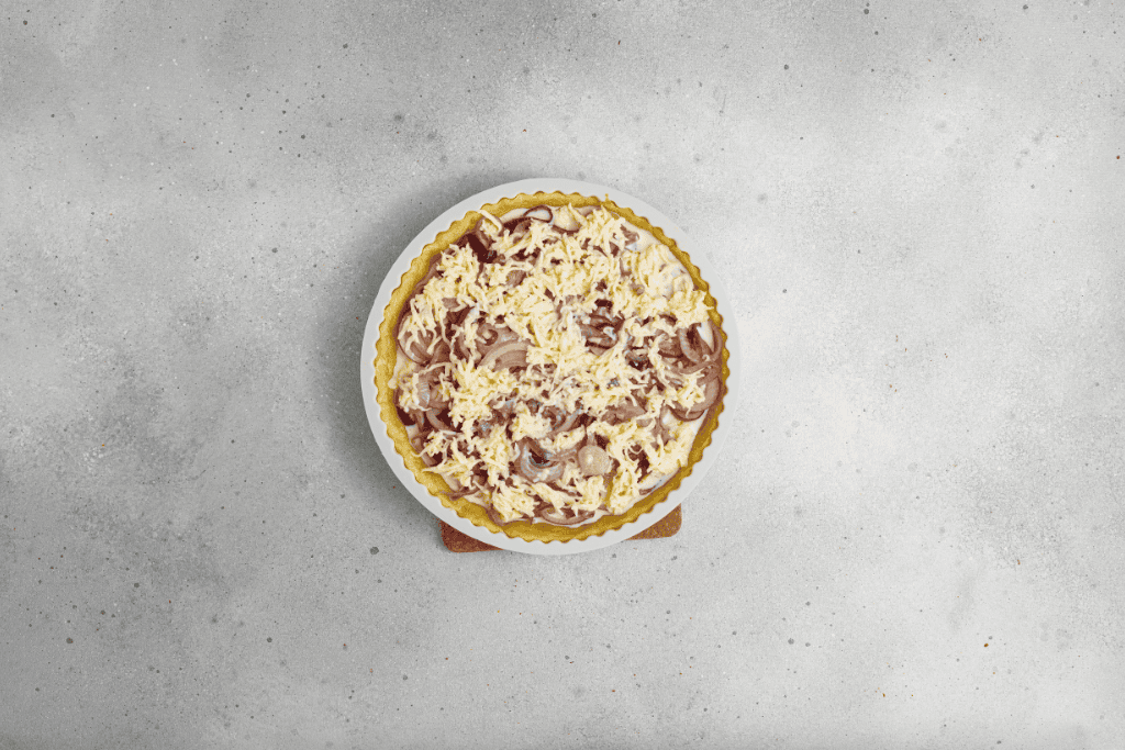 caramelized onions and cheese cream mixture on top of the crust