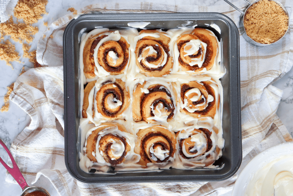 glazing the cinnamon rolls