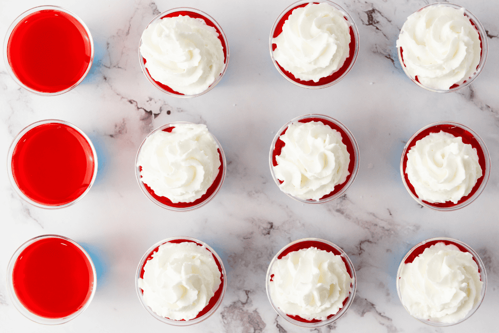 jello shots with whipped cream on top