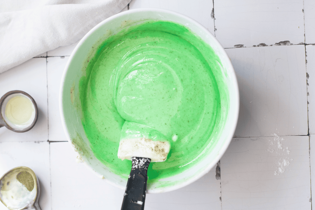 mixing up the green filling ingredients