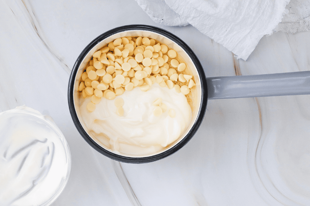 mixing up white chocolate chips and cream