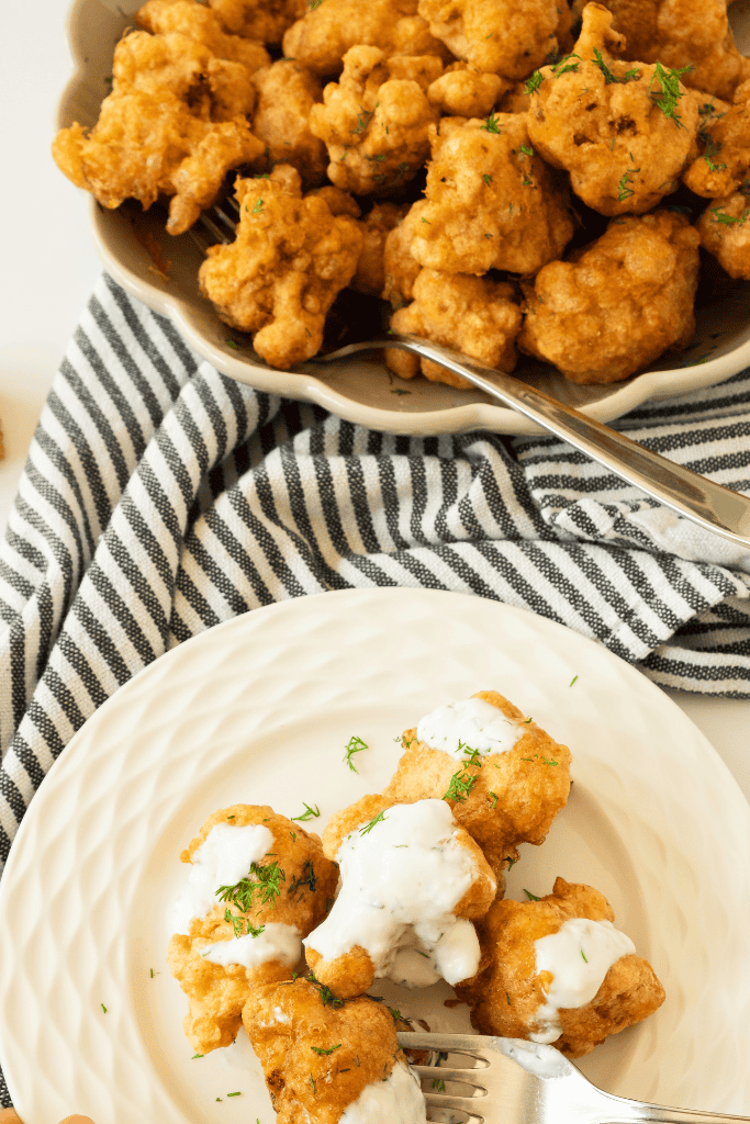 plate of crispy cauliflower bites with sauce