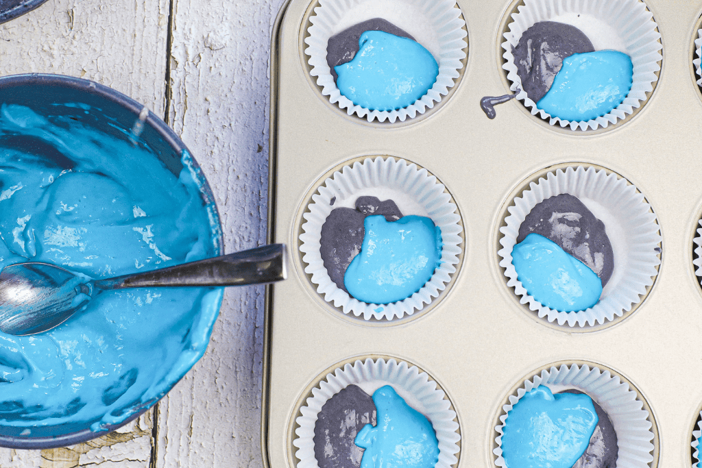 filling the lined muffin tin