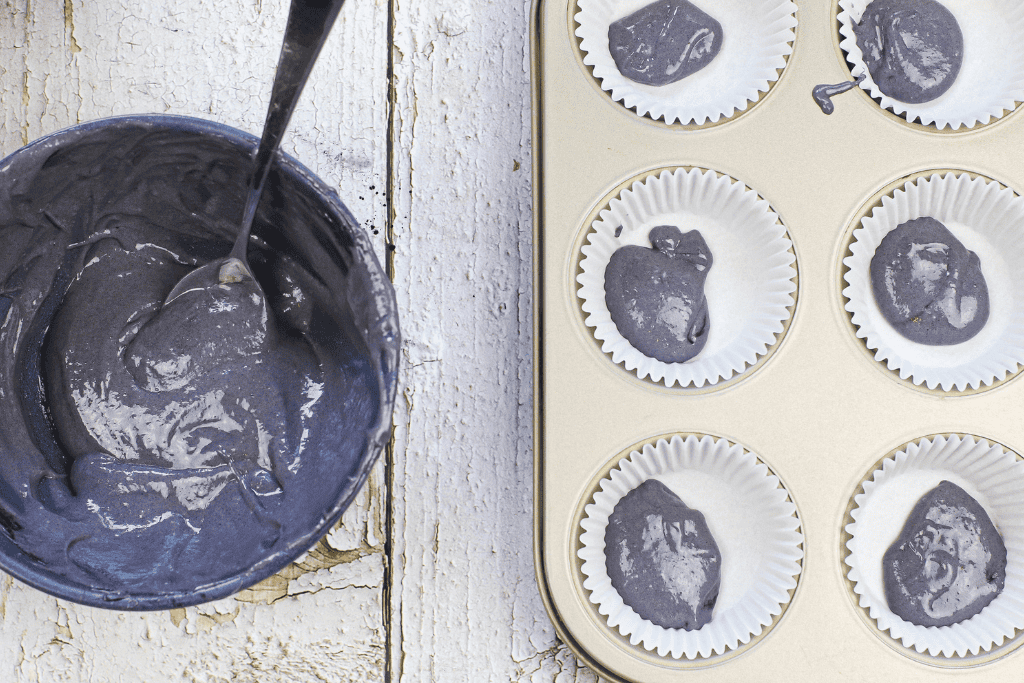 filling the lined muffin tin