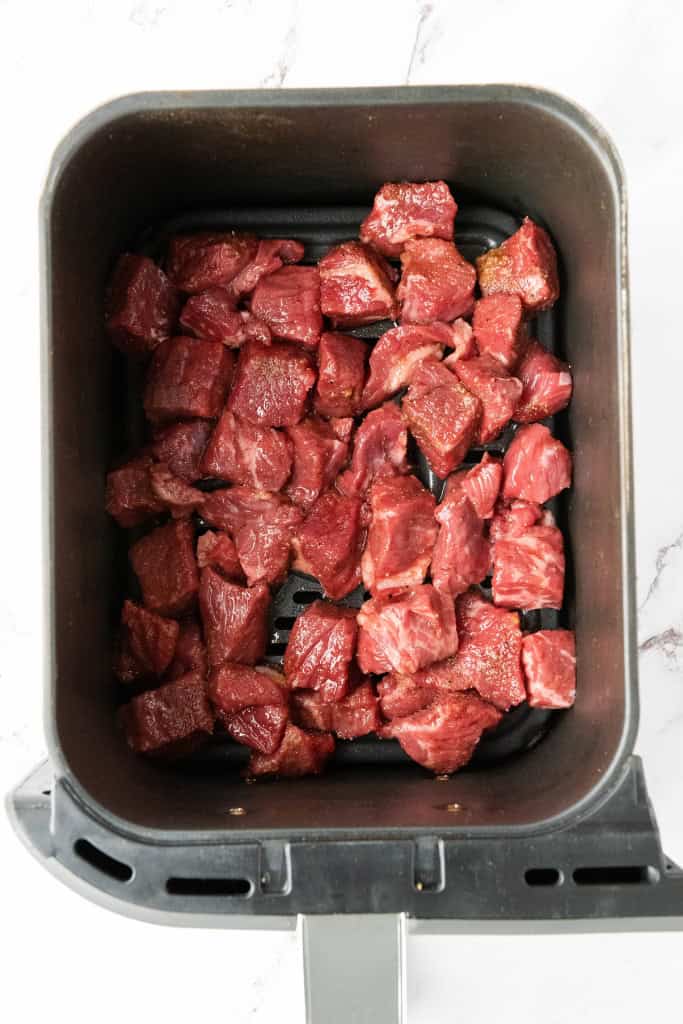 Steak bites in air fryer basket