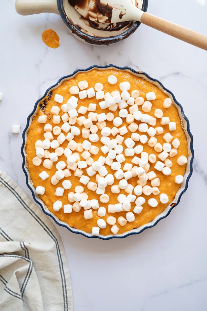 mini marshmallows scattered on top of the sweet potato pie
