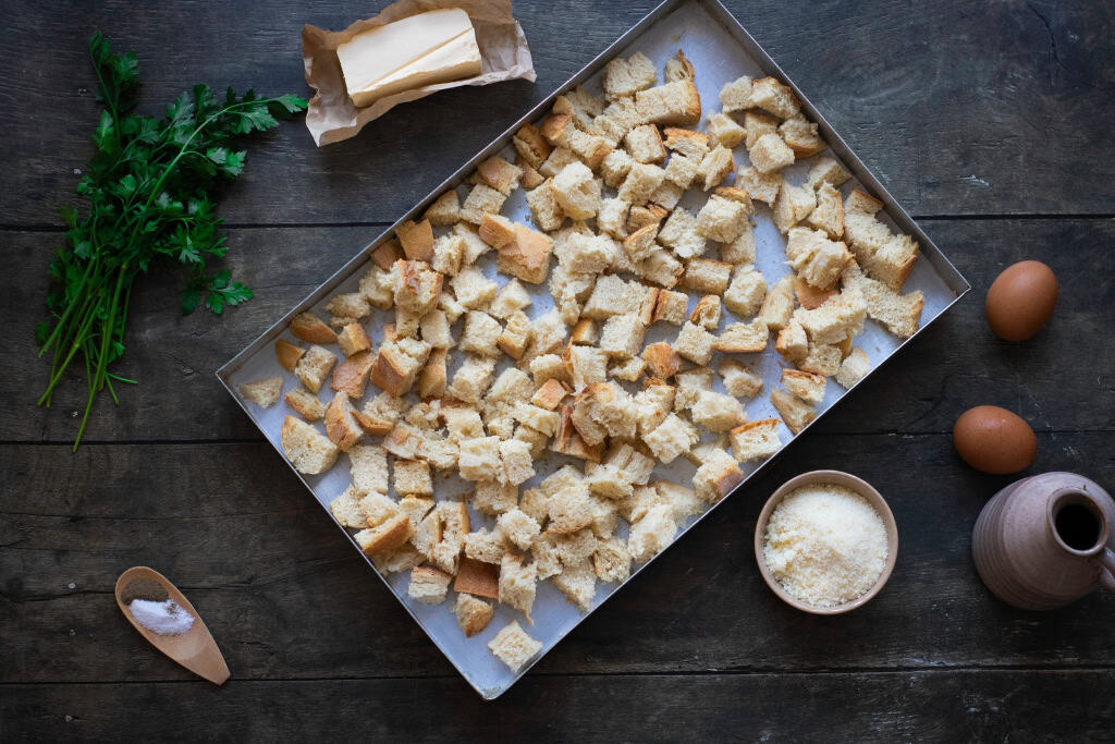 bread cubes on a baking sheet