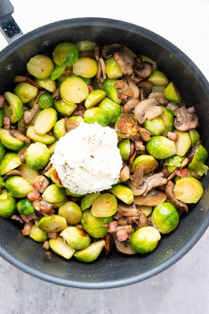 Boursin cheese added to pan