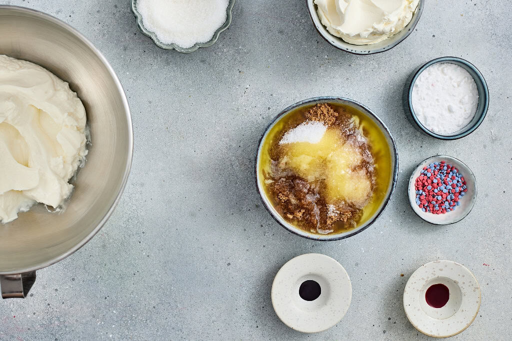 mixing together crust ingredients for Patriotic No Bake Cheesecakes