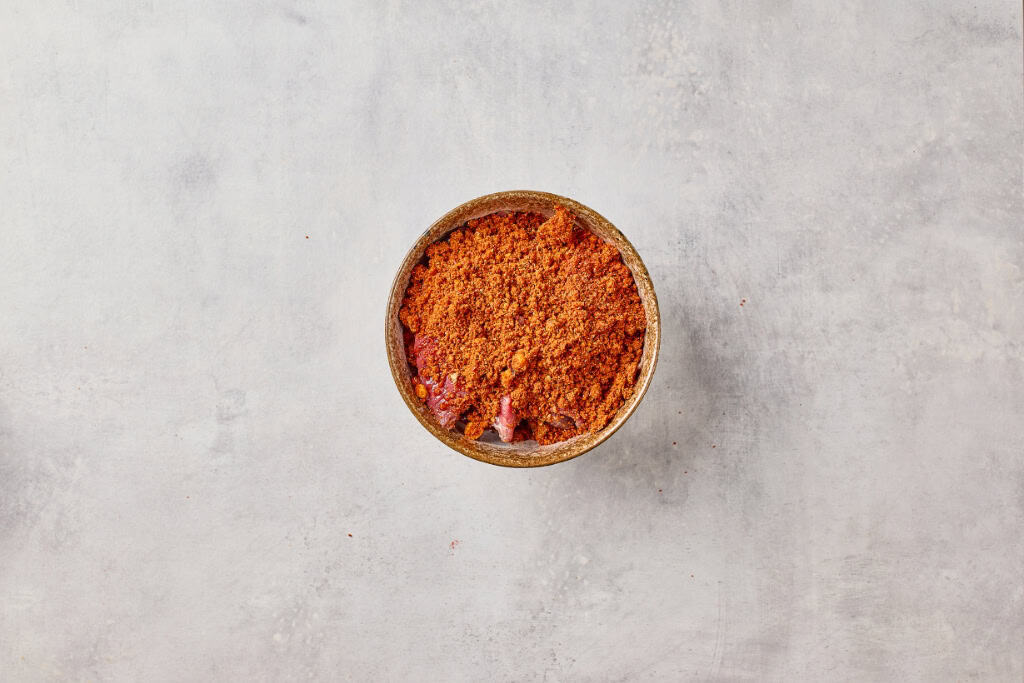 marinating the beef with spice mix