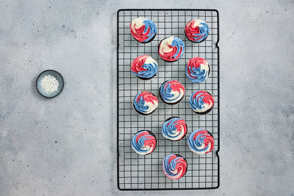 buttercream swirled onto cupcakes